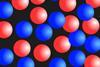An illustration with red and blue circles representing particles of two gases mixing