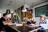 An image showing a father and children working from home during coronavirus
