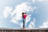 Girl looking into the sky with binoculars