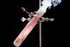 A photo of a jellybaby burning in a test tube