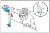 A boy pours liquid into a large measuring cylinder while considering which size cylinder would be best