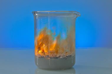 A photo of flames in a glass beaker
