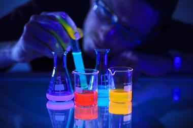 An image showing beakers containing the chemoluminescent compound luminol in beakers