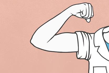 Someone wearing a lab coat flexing their bicep