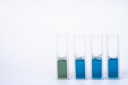 Reagent in cuvettes on white background