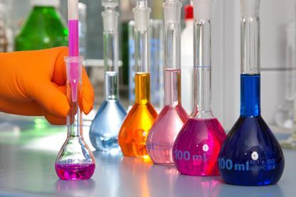 Row of five volumetric flasks