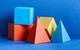 a selection of different coloured solid shapes