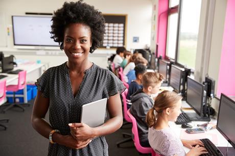 Female teacher in a computer room