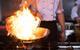 Chef doing flambe on food