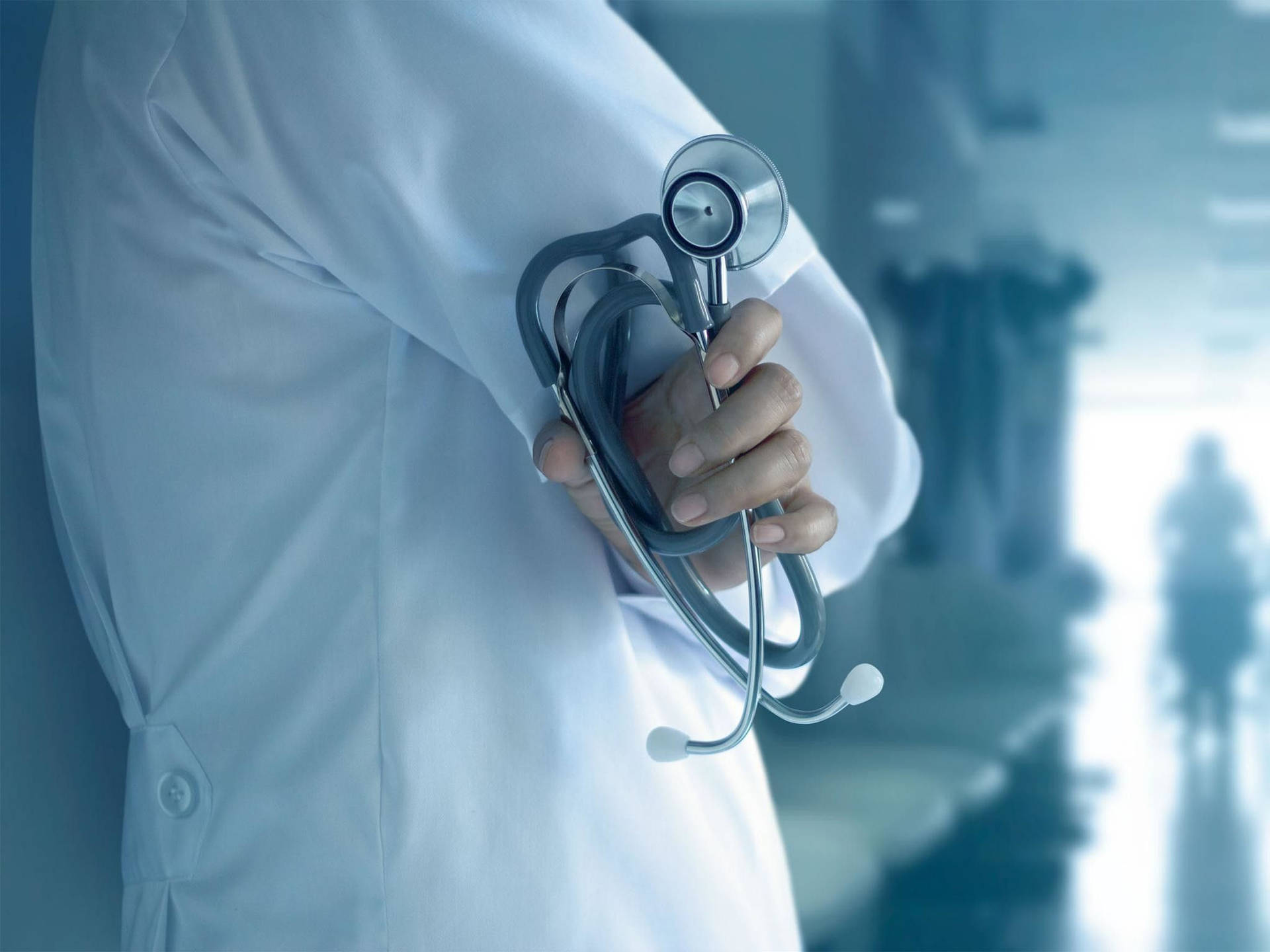 Dedicated Physician in a Modern Hospital Setting Wallpaper