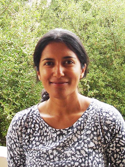 Hemamala Karunadasa smiling to camera in floral top
