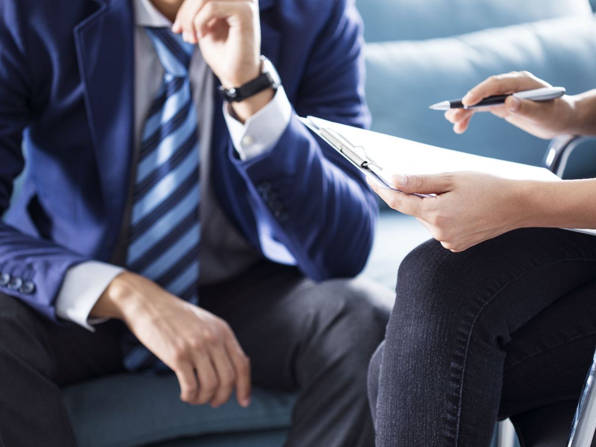 Two people discussing a plan or document