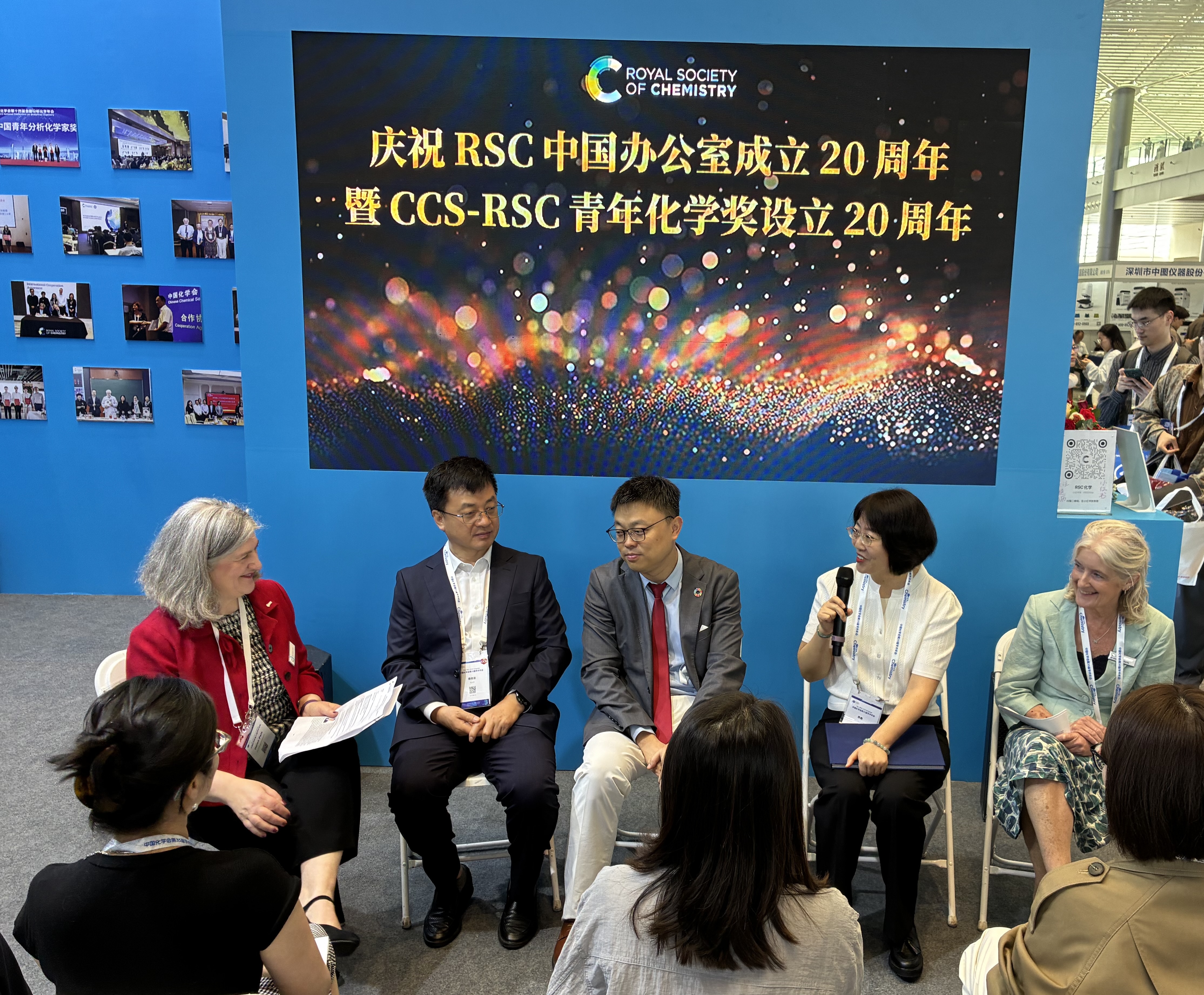 CCS-RSC Young Chemist - 1 (RSC in China 2026) Dr Helen Pain (left) and Dr Annette Doherty (right) sit either side of three speakers on stage at the CCS Congress