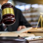Closeup shot of a judge holding a gavel.