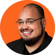 A man wearing glasses and a black shirt.