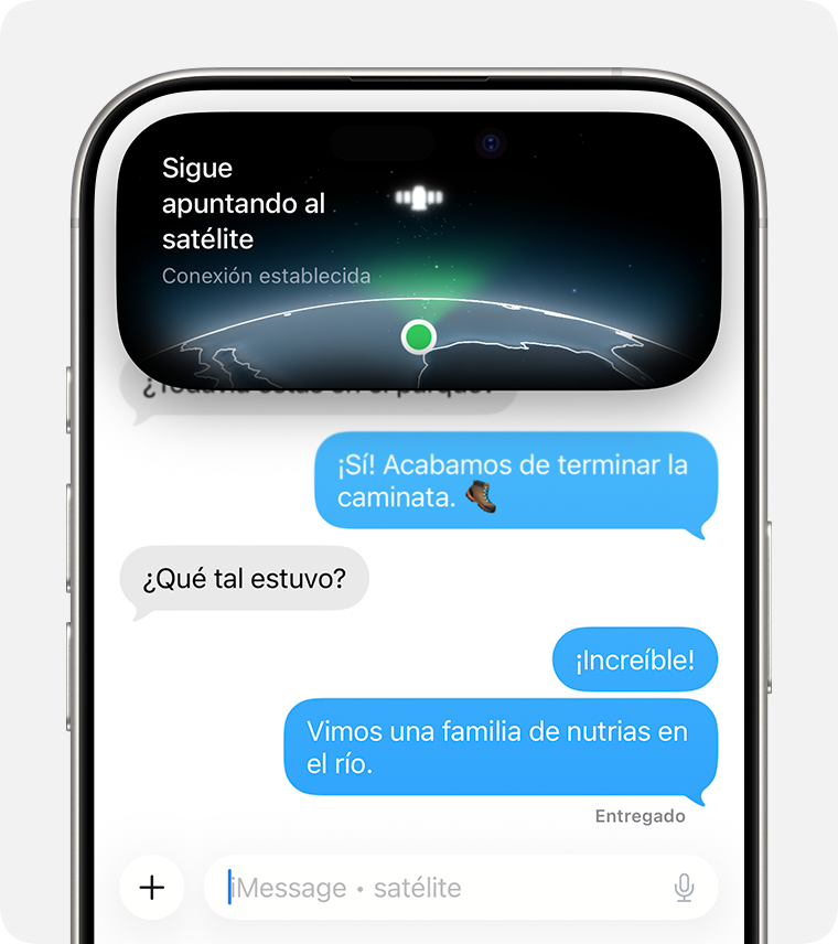 Enviar un mensaje de texto vía satélite en la app Mensajes. Dynamic Island indica una conexión satelital fuerte.