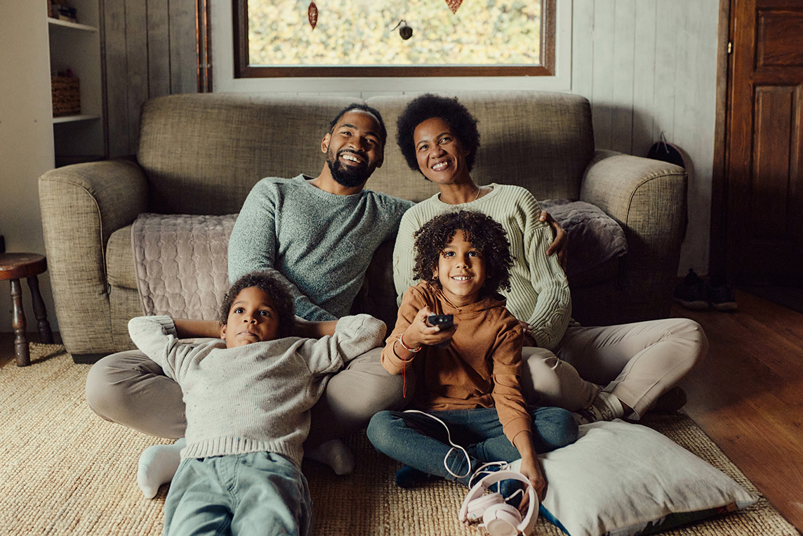 family watching Verizon Fios TV together