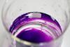 A photograph showing potassium permanganate in a glass beaker