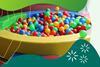 A children's ball pool filled with coloured balls
