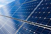 A picture showing solar panels with blue sky and white colours top left corner to illustrate an article about fuelling the future with hydrogen, solar and wind power