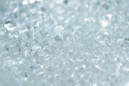 A macro photograph of many colourless hydrogel beads