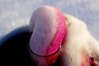 A photograph showing the catalytic decomposition of hydrogen peroxide in a soap solution
