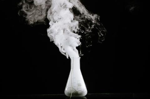 A conical flash with white gas escaping from it (the catalytic decomposition of hydrogen peroxide)