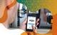 Photo of a man checking an electricity meter on his phone