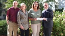 Check presentation to support new scholarship.