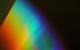 Visible light spectrum from red to blue on black background