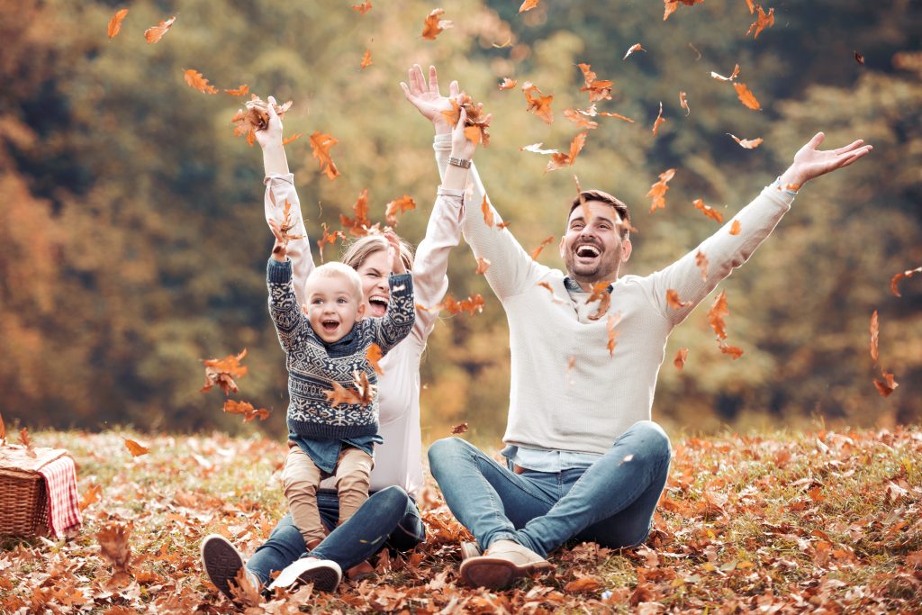 family playing in autumn park