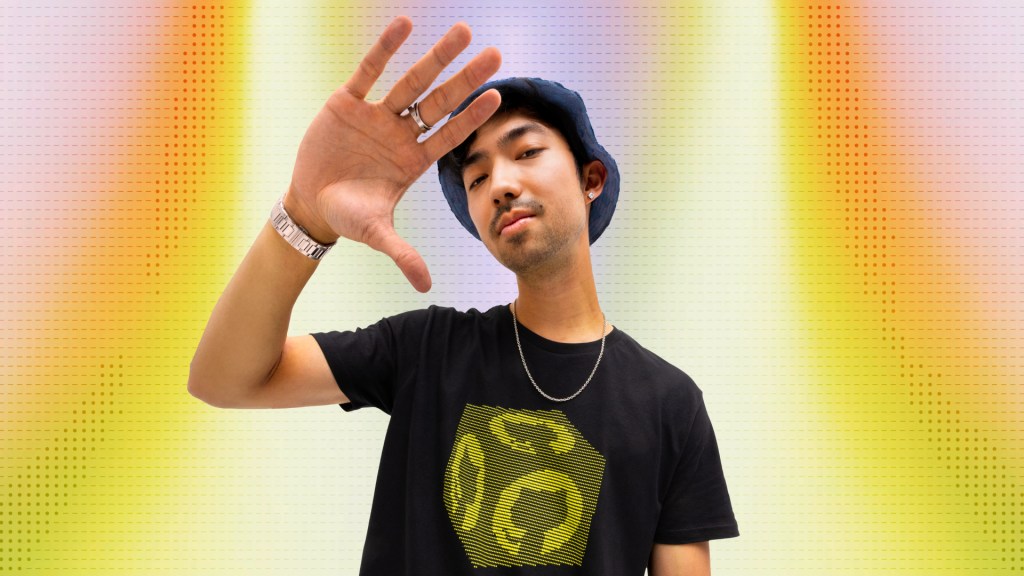 A man wearing an ASCII tee shirt.