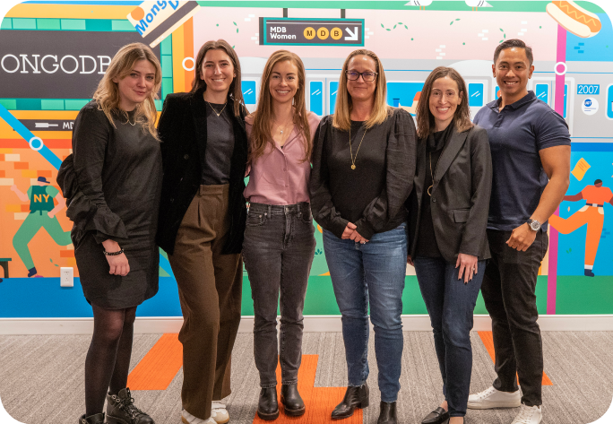 MongoDB employees smiling at the office