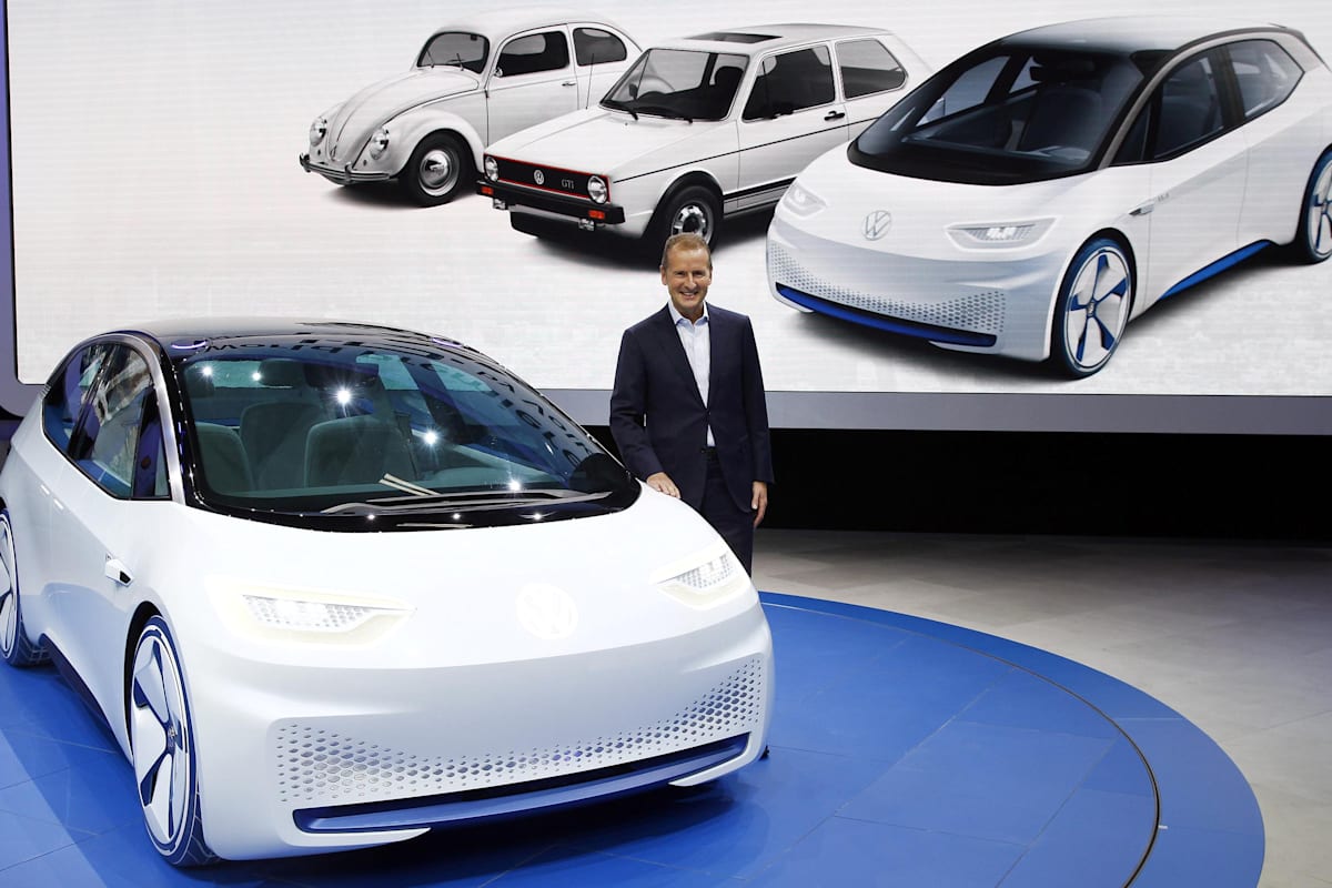 PARIS, FRANCE - SEPTEMBER 29: Herbert Diess, head of the Volkswagen (VW) brand poses next to the new Volkswagen I.D. concept electric automobile during the press day of the Paris Motor Show on September 29, 2016, in Paris, France. The Paris Motor Show will showcase the latest models from the auto industry's leading manufacturers at the Paris Expo exhibition centre. (Photo by Chesnot/Getty Images)