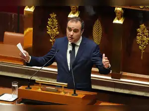 Political crisis in France eases for now as prime minister survives no-confidence vote