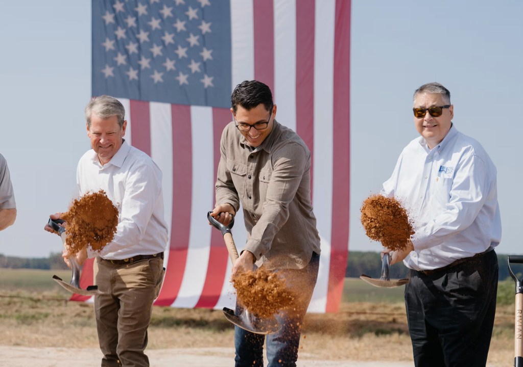 Governor Brian Kemp and Rivian CEO RJ Scaringe break ground at the planned Georgia factory.