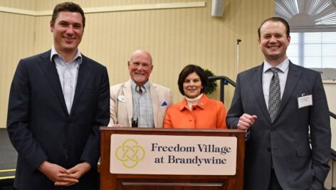 Freedom Village community liaison Ben LaGarde (second from left) stands with Chester County Commissioners Josh Maxwell, Marian Moskowitz, and Eric Roe.