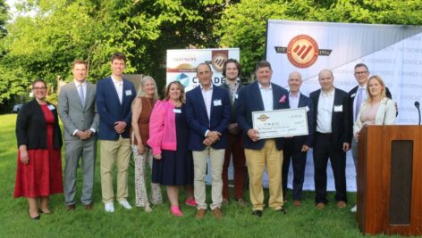 TMACC team with giant check.
