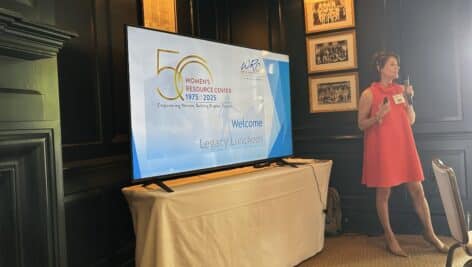 Beth Monroe, the center’s executive director, speaks at the 50th anniversary luncheon.