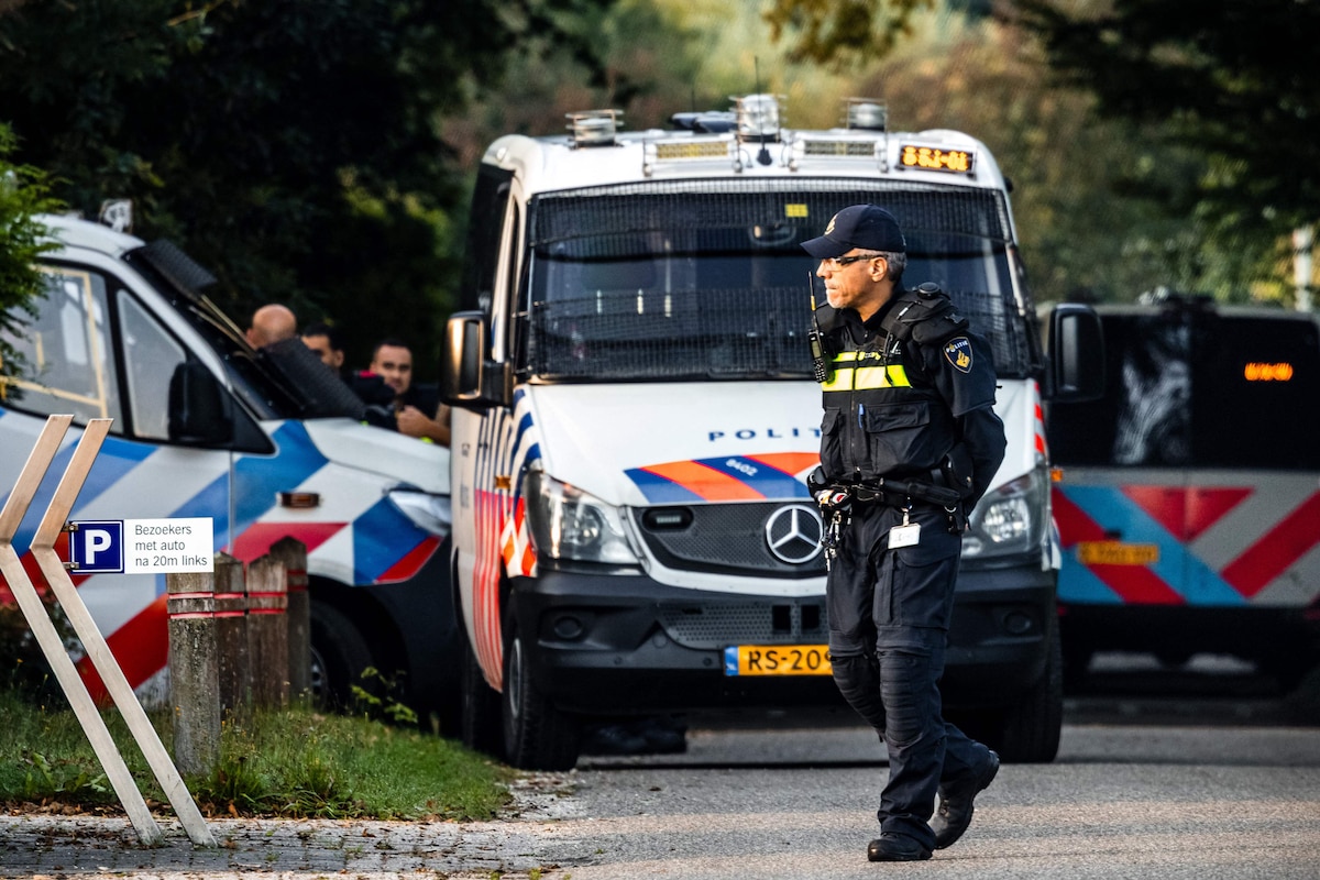 Police vehicles are seen at the site, a day after a shooting incident, resulting in the death of a 51-year-old, reportedly a security guard, in Overasselt, southeastern Netherlands on September 2, 2026. Dutch authorities said on September 1 they had arrested 34 people, including French, Belgian and Algerian nationals, after a pre-dawn shootout reportedly linked to a notorious drug lord that claimed one life. (Photo by ROB ENGELAAR / ANP / AFP) / Netherlands OUT