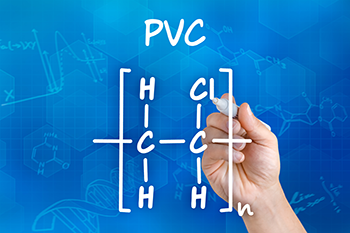an illustration of a hand writing the checmical formula for PVC